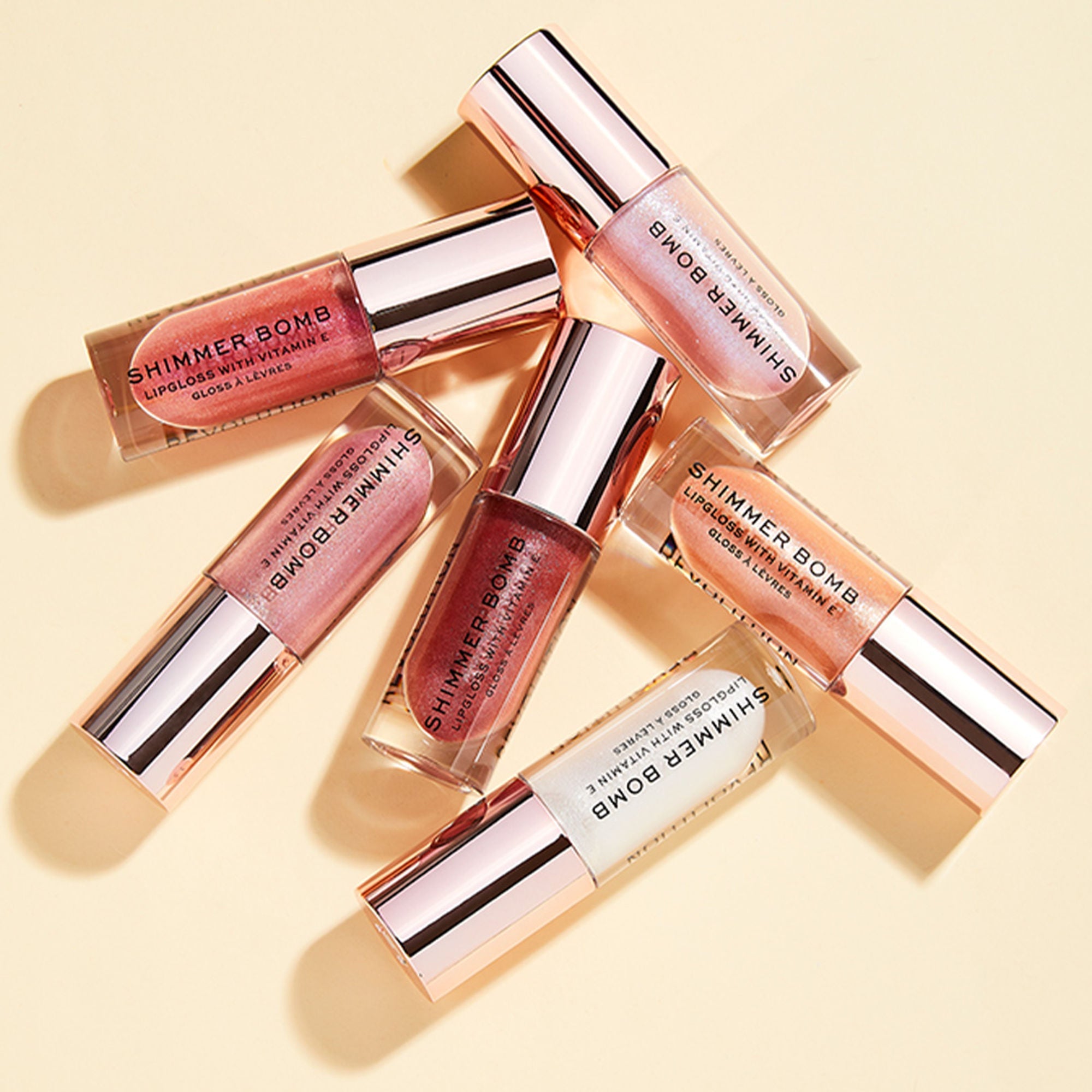 Makeup Revolution Shimmer Bomb Lip Gloss Infused With Vitamin E For Extra Nourishment - Glimmer Nude