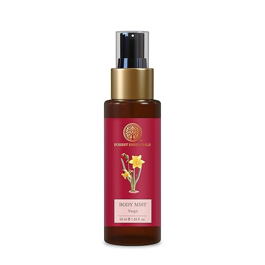 Body mist bottle with red label and gold cap on white background