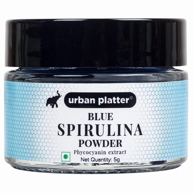 Jar of blue spirulina powder with 'urban platter' branding on a white background