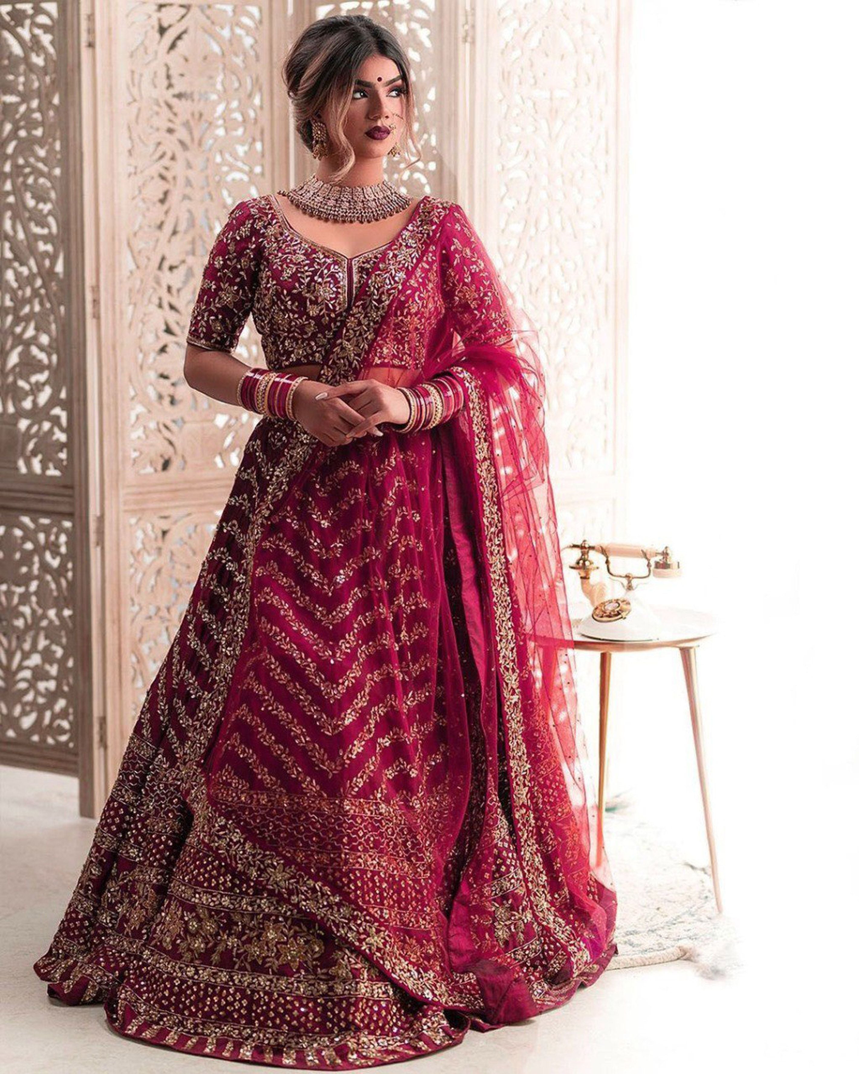 Aastha fashion off wine Lehenga Choli with silk net blouse fabric