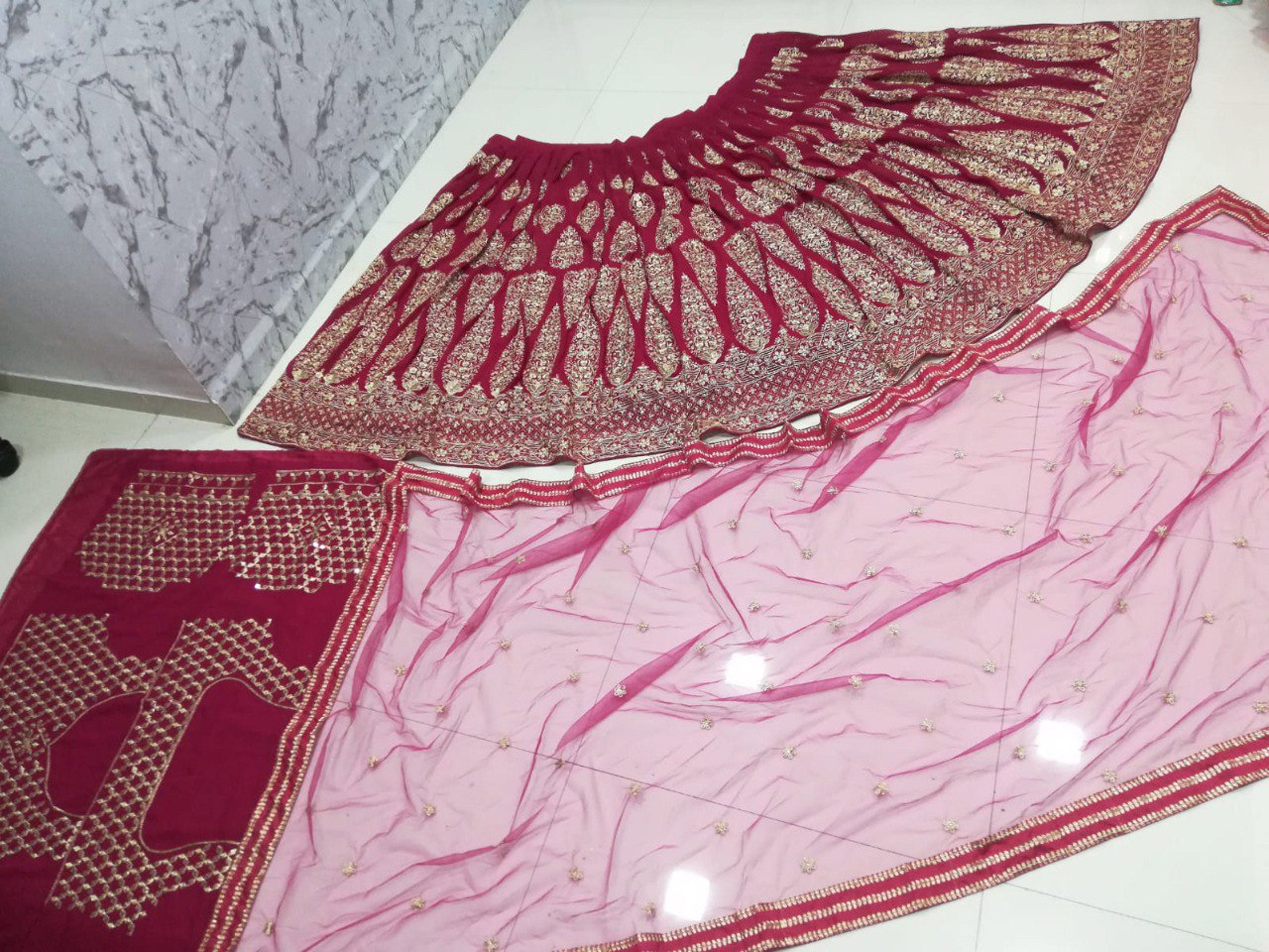 Aastha fashion off magenta Lehenga Choli with faux georgette blouse fabric