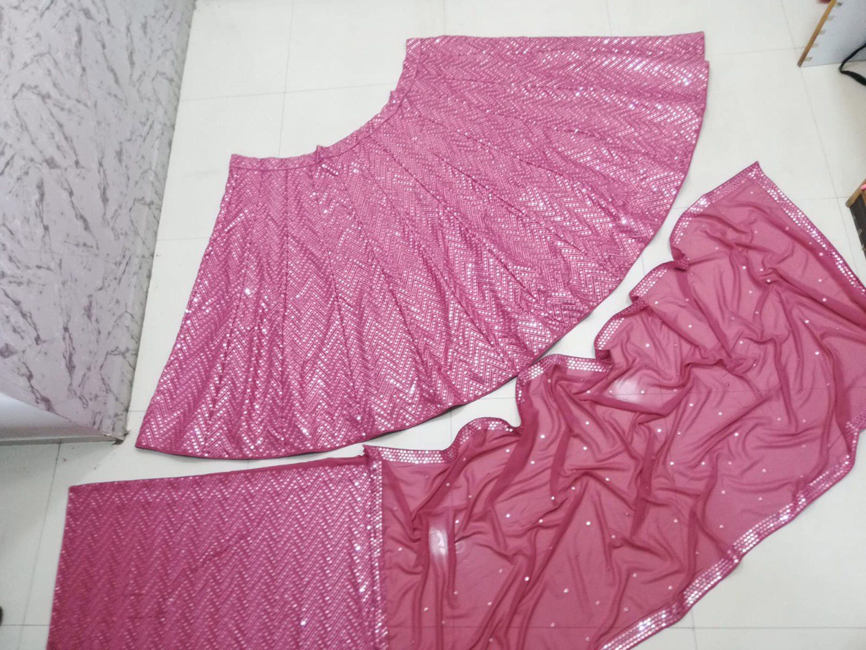 Aastha fashion off magenta Lehenga Choli with faux georgette blouse fabric