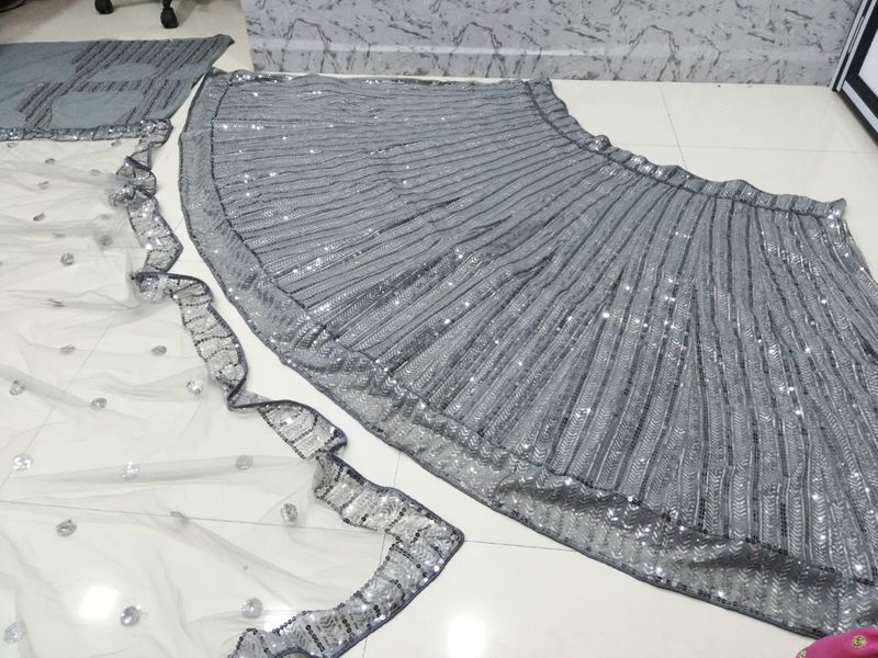 Aastha fashion off grey Lehenga Choli with silk net blouse fabric