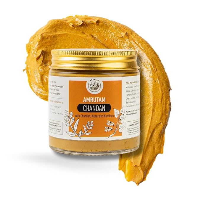 Jar of Amrutam Chandan with a gold lid on a white background