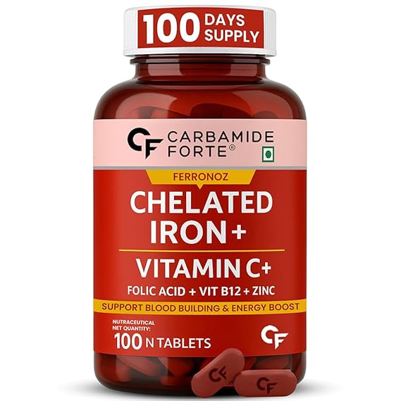 Bottle of Carbamide Forte Chelated Iron + Vitamin C supplement with red label and white text.