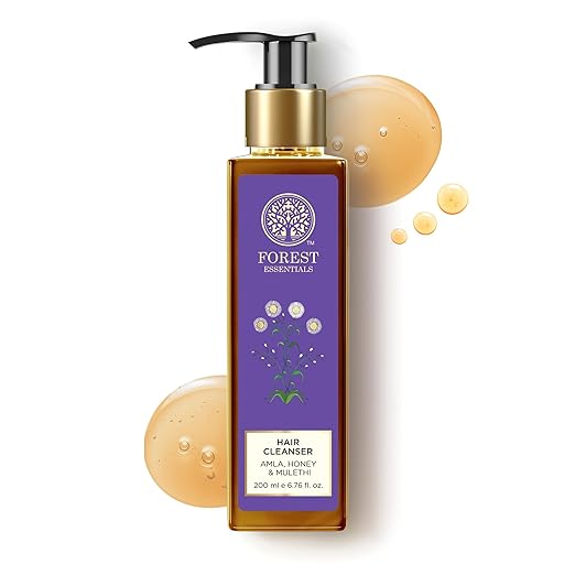 Bottle of Forest Essentials hair cleanser with a purple label on a white background