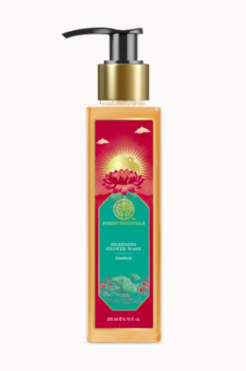 Bottle of shower wash with a gold pump on a white background