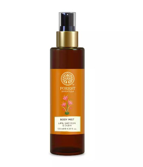 Body mist bottle with orange label and gold cap on white background