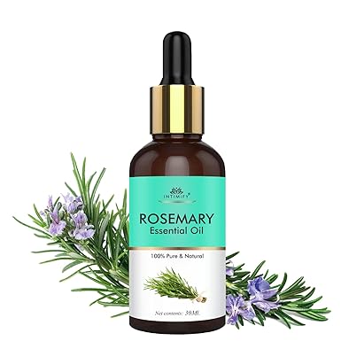 Rosemary essential oil bottle with dropper and rosemary leaves on a white background