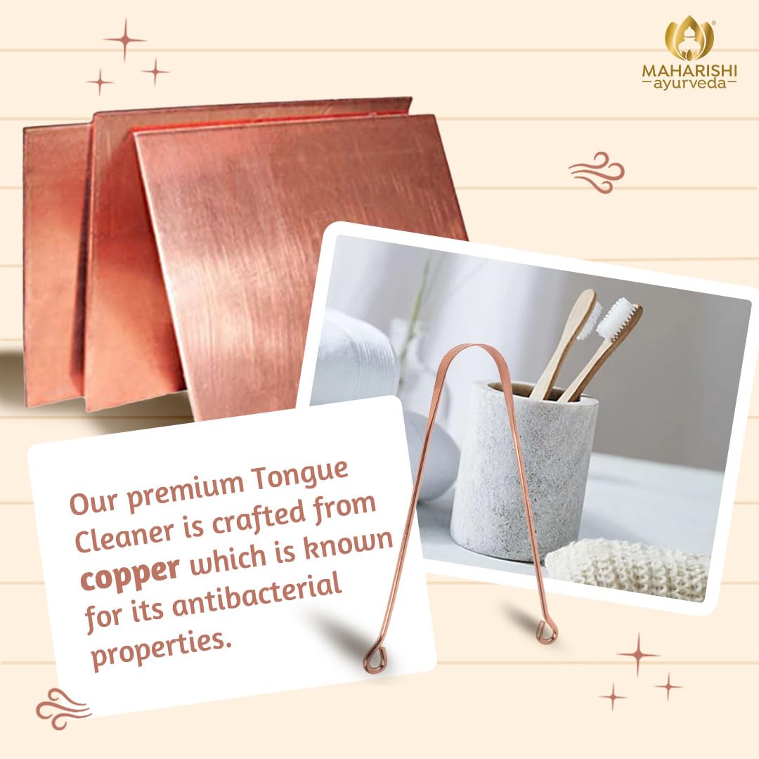 Copper tongue cleaners with a card explaining their antibacterial properties on a wooden background.