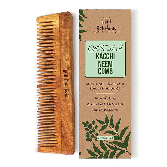 Wooden comb and its packaging on a white background