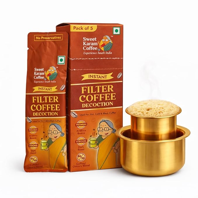 Sweet Karam Coffee instant filter coffee decoction packaging with a brass cup on a white background