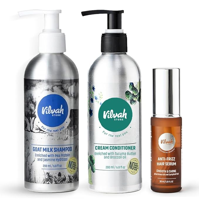 Vilvah Store hair care products including shampoo, conditioner, and serum on a white background