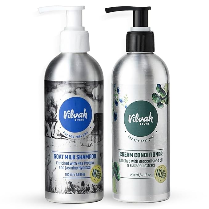 Two Vilvah Store shampoo and conditioner bottles on a white background